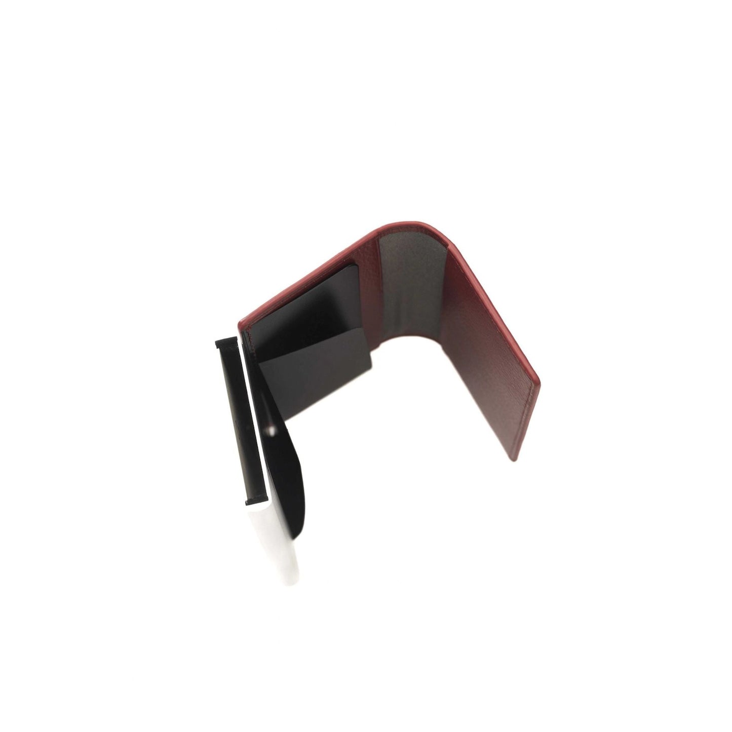 Black and red guitar capo on a white background