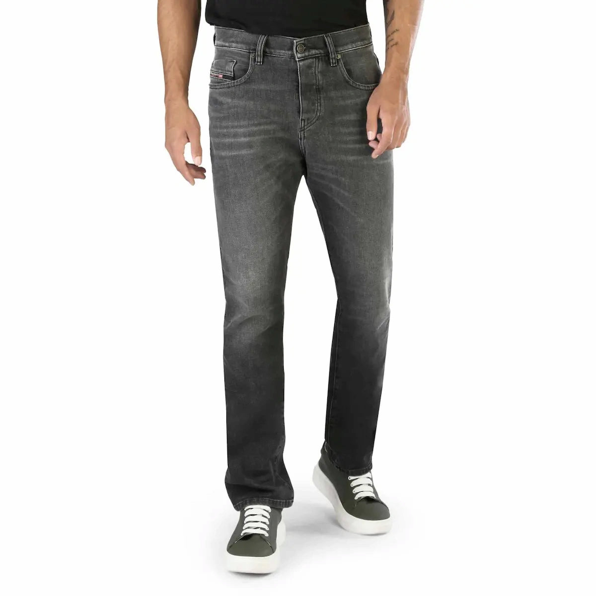 Person wearing gray jeans on a white background