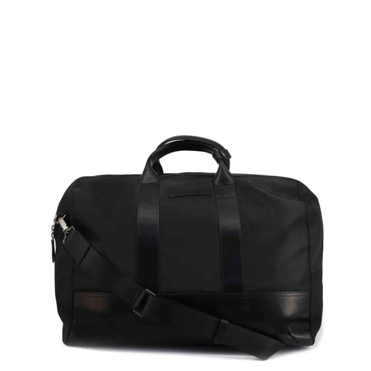 Black duffel bag with a shoulder strap on a white background